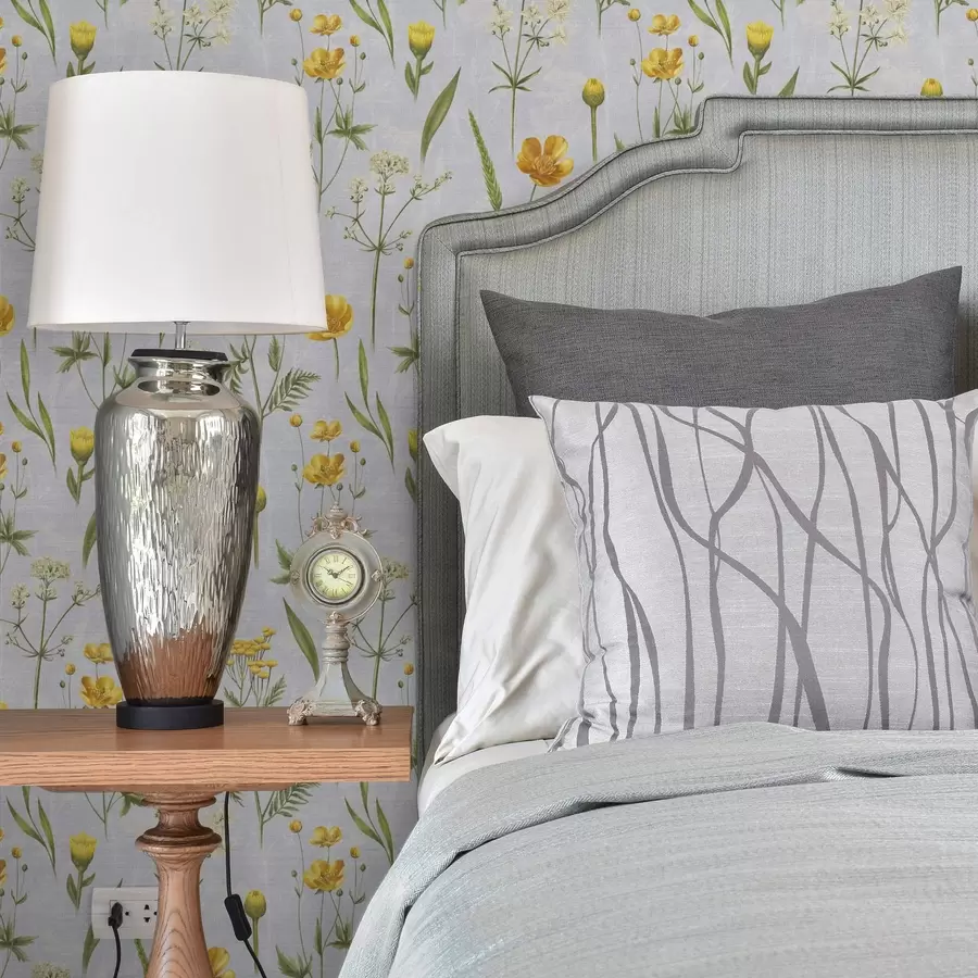 Fototapetes Dzelteni ziedi un zaļumi uz gaiši pelēka fona a00472